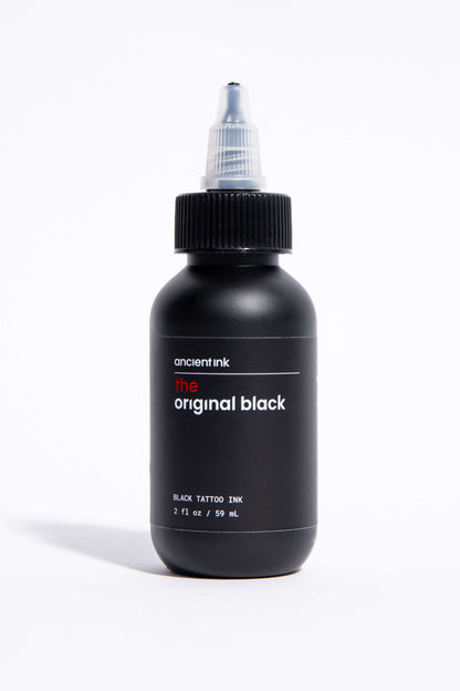 Black tattoo ink bottle labeled 'original black' on a white background