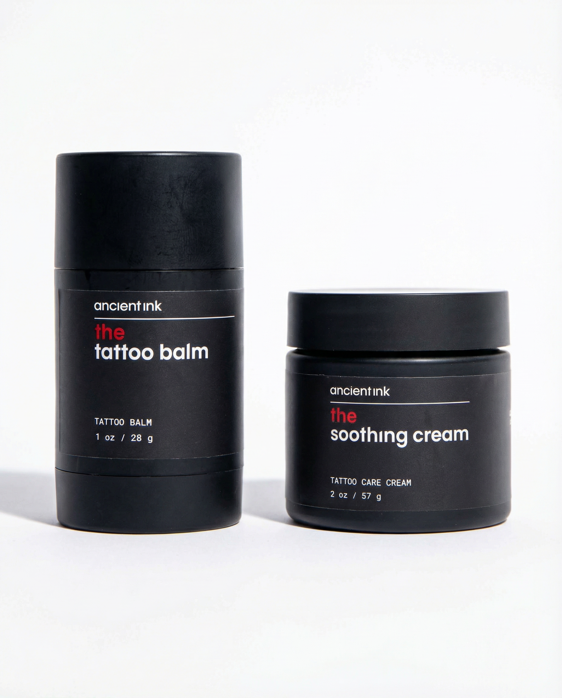 Two black containers of 'ancient ink' tattoo care products on a white background