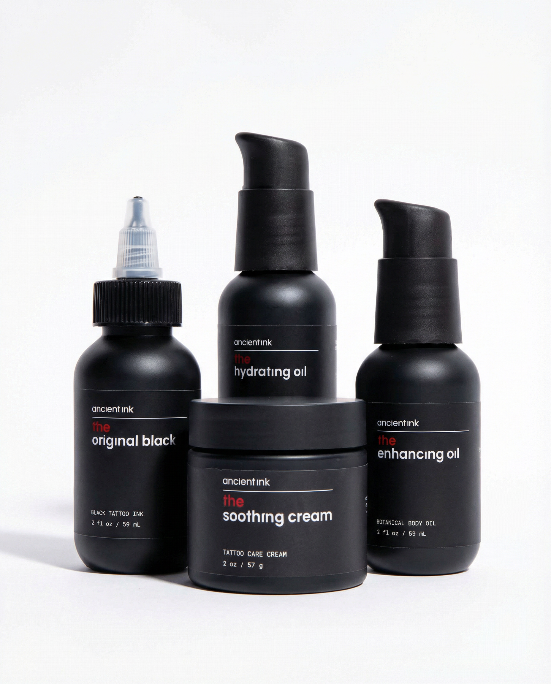 Set of black skincare products from Ancient Ink on a white background