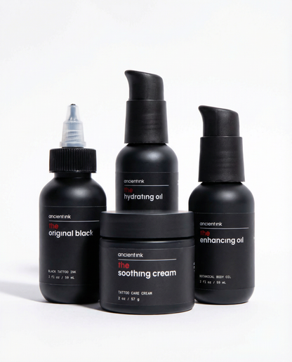 Set of black skincare products from Ancient Ink on a white background